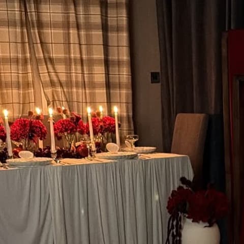A candlelit dessert styling detail from a romantic red celebration.